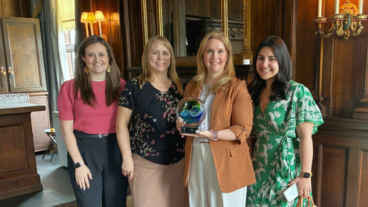 Pictured, from left to right, Summer 2026 associate, Taylor Albertini, senior attorney, Kim Conklin, Partner, Amy Luck and Associate, Natalie Sullivan Baker from RCO Law with the award received at the Toledo Women's Bar Association Annual Meeting